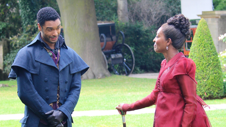 Regé-Jean Page and Adjoa Andoh filming