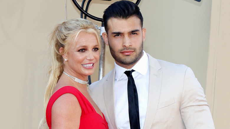 Britney Spears nervous smile with Sam Asghari on red carpet