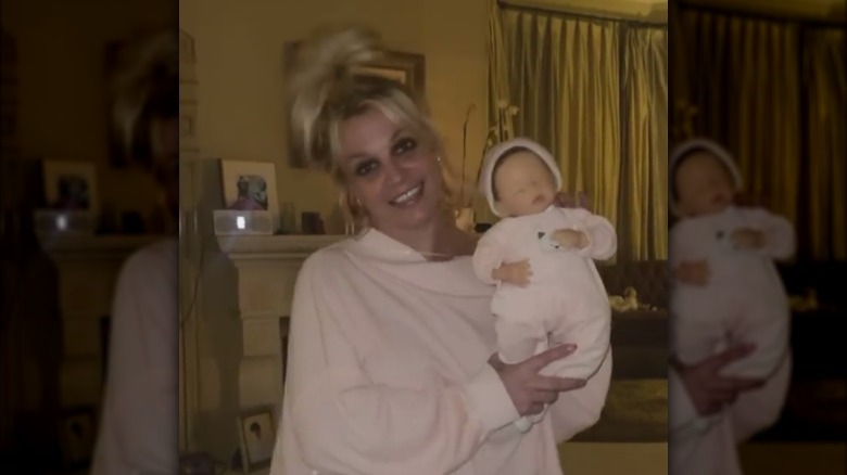 Britney Spears holding a doll