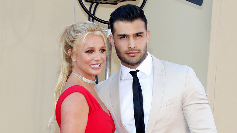 britney spears and sam asghari on a red carpet