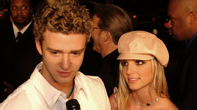 Justin Timberlake and Britney Spears talking to reporters
