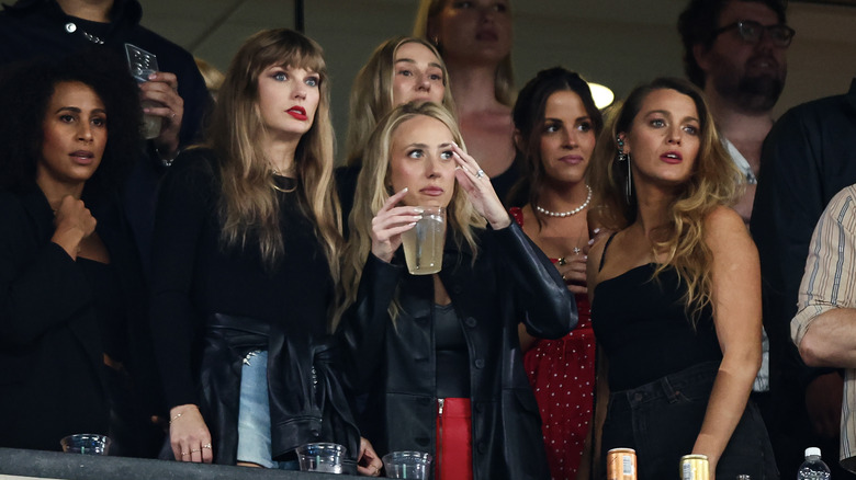 Taylor Swift, Brittany Mahomes with concerned expressions