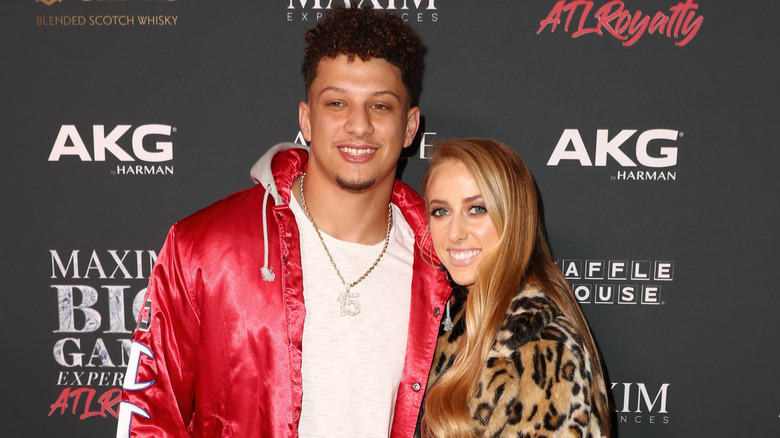 Brittany Mahomes and Patrick Mahomes smiling