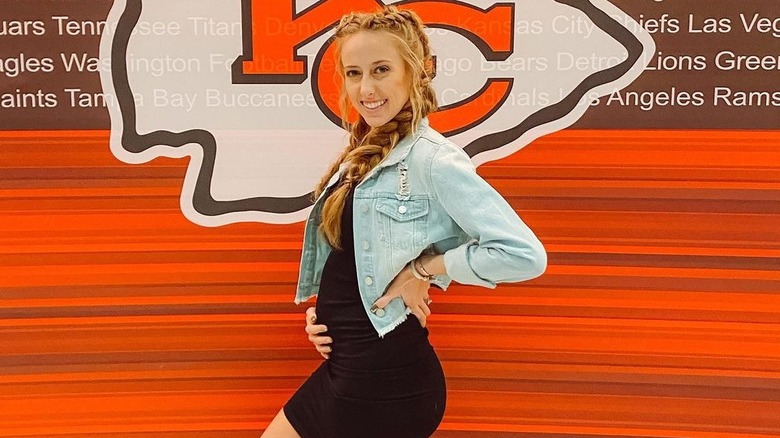 Brittany Mahomes with hand on stomach