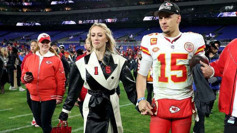 Brittany, Patrick Mahomes holding hands