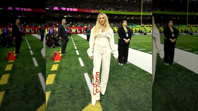 Brittany Mahomes posing on the field