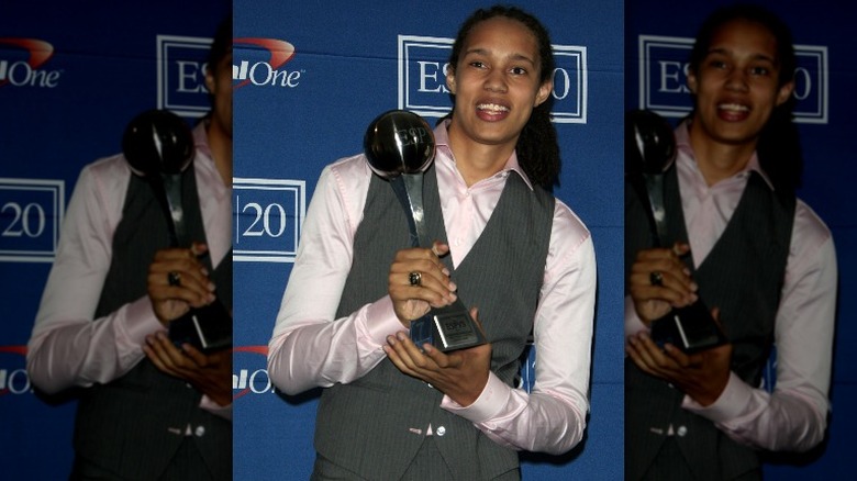 Brittney Griner holding an award