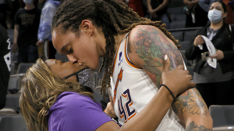 Brittney Griner #42 of the Phoenix Mercury kisses her wife Cherelle Griner