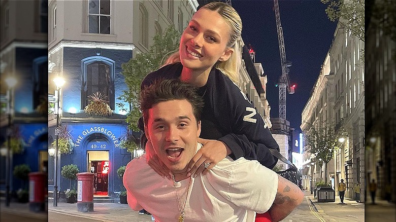 Brooklyn Peltz Beckham piggybacking Nicola Peltz Beckham 