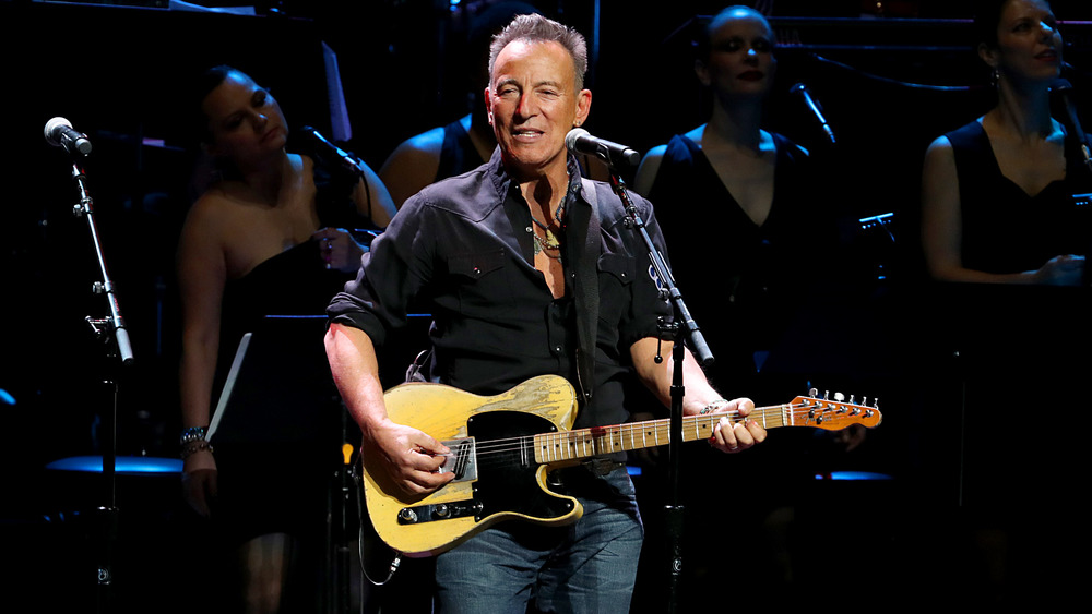 Bruce Springsteen performing with guitar