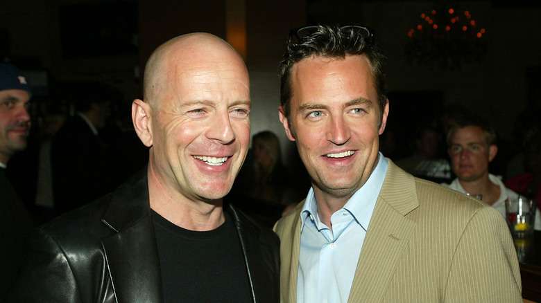 Bruce Willis poses with Matthew Perry