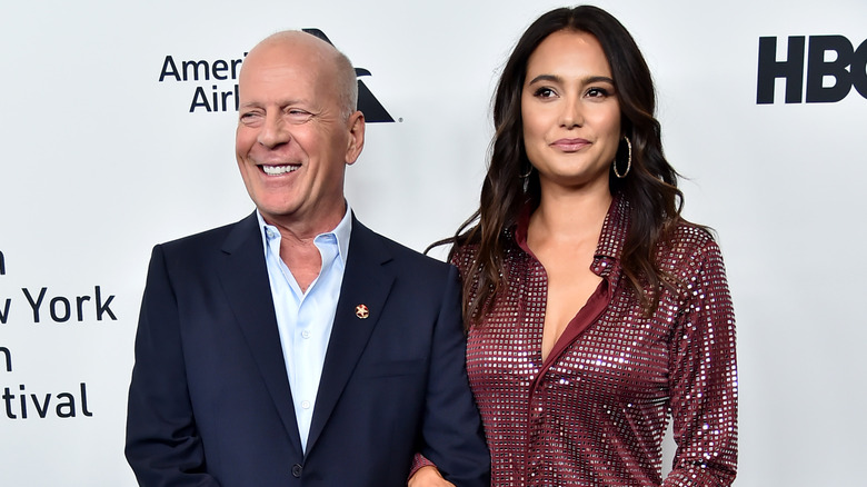 Bruce Willis and Emma Heming posing