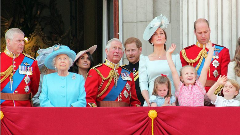 Prince Andrew, Queen Elizabeth II, Meghan Markle, Prince Charles, Prince Harry, Kate Middleton, and Prince William on a balcony