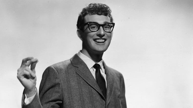 Buddy Holly snapping his fingers.