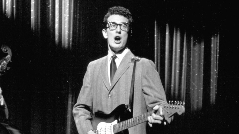 Buddy Holly performing on stage.