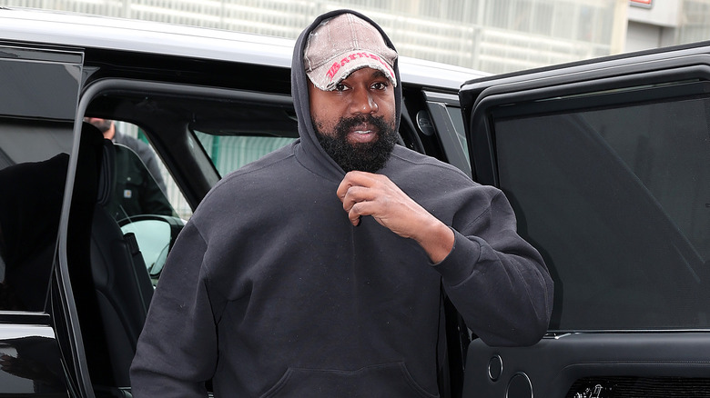 Kanye West exiting car