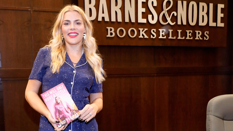 Busy Philipps posing with her book