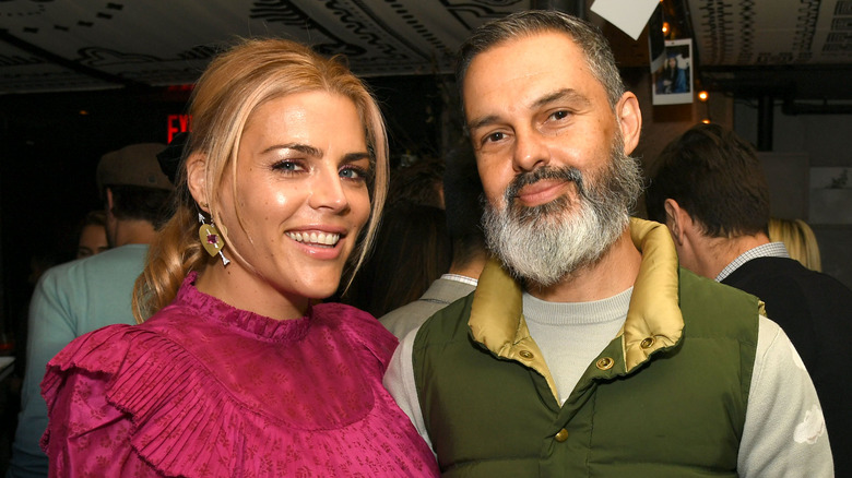 Busy Philipps and Marc Silverstein smiling together