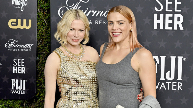 Michelle Williams and Busy Philipps posing together