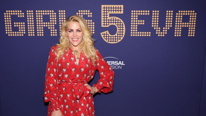 Busy Philipps posing in front of Girls5Eva sign