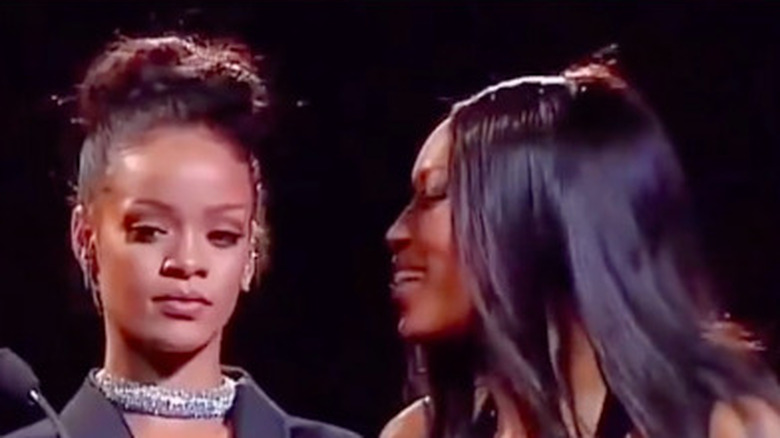 Naomi Campbell whispers in Rihanna's ear