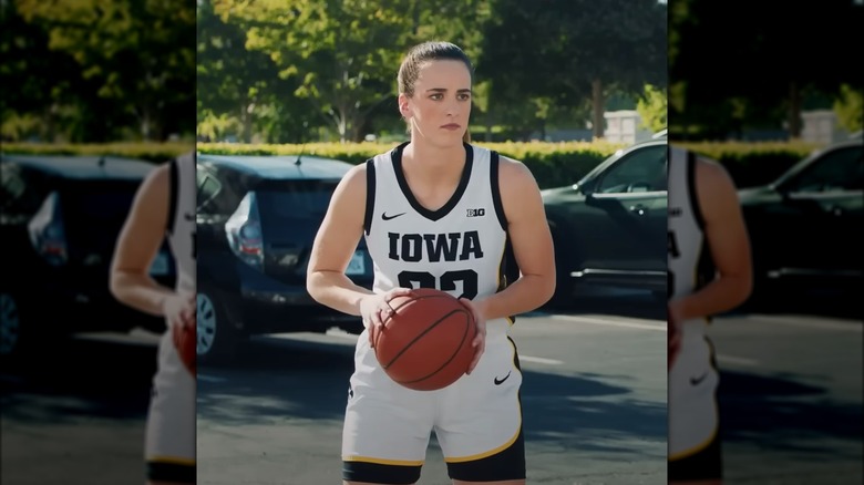 Caitlin Clark holding basketball