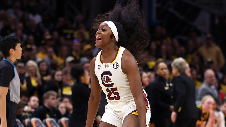 Raven Johnson cheering, wearing a white jersey