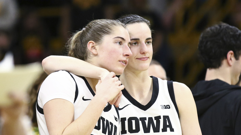 Caitlin Clark with arm around Kate Martin