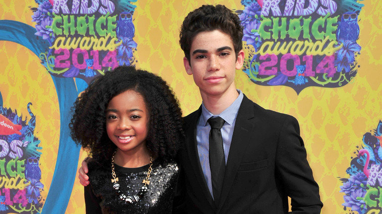 Skai Jackson and Cameron Boyce posing together on a red carpet