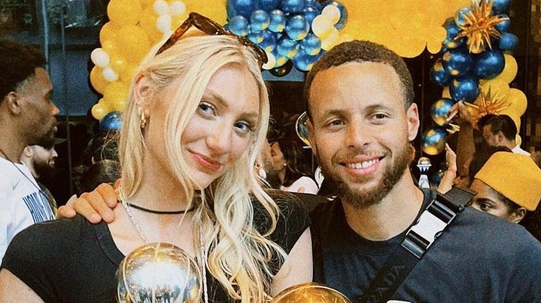 Cameron Brink and Steph Curry pose together