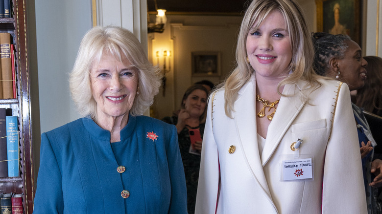 Camilla Parker Bowles and Emerald Fennell smiling 