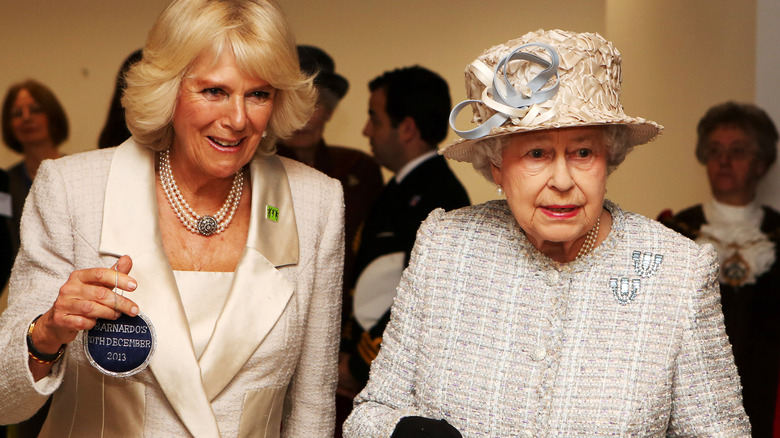 Camilla Parker Bowles and the Queen smiling 