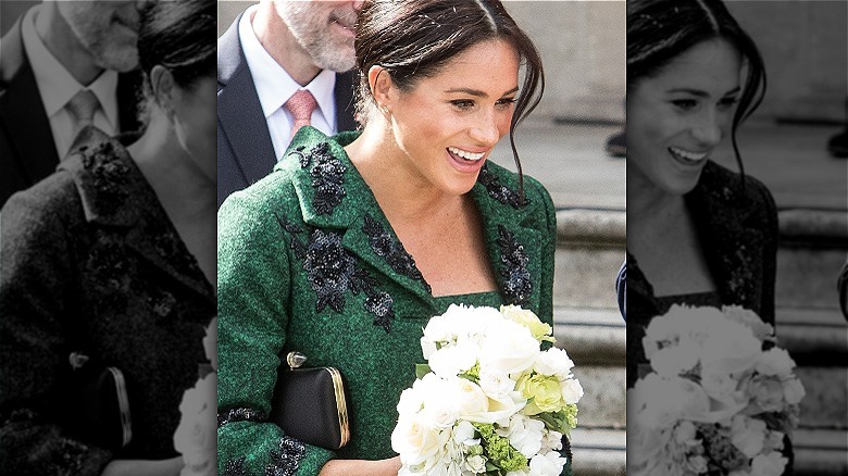 Meghan Markle holding flowers