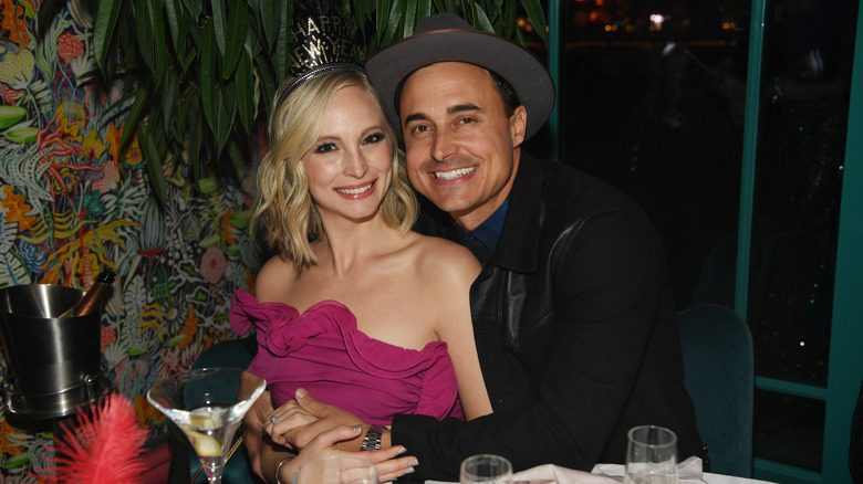 Candice Accola and Joe King pose at a table