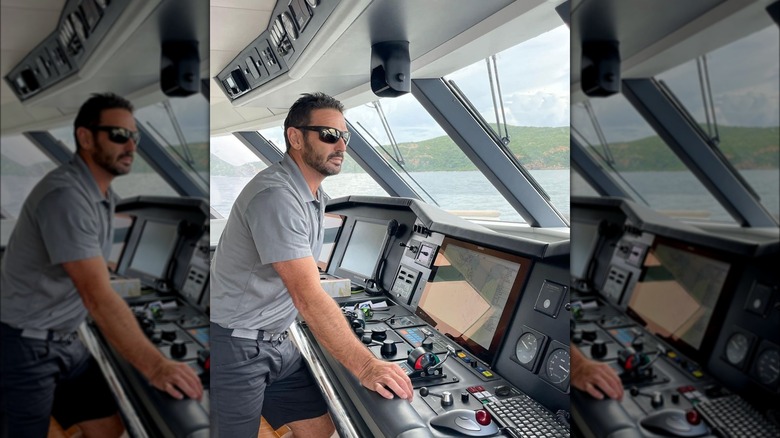 Jason Chambers captaining a yacht