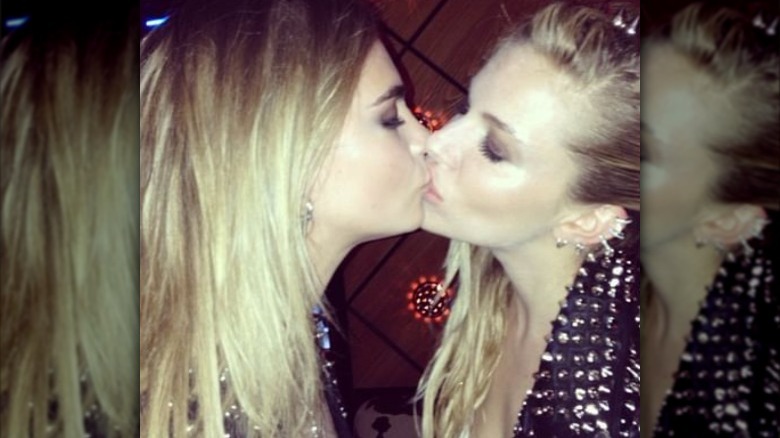 Cara Delevingne and Sienna Miller kissing