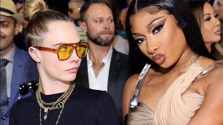 Cara Delevingne looking at Megan Thee Stallion