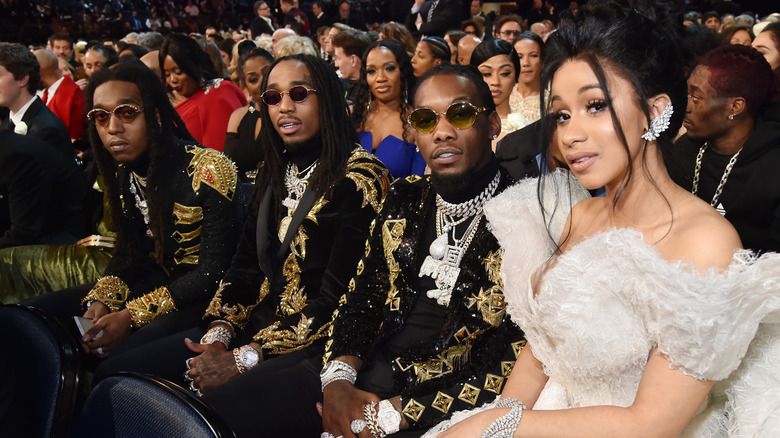 Rappers Takeoff, Quavo, Offset and Cardi B sitting together