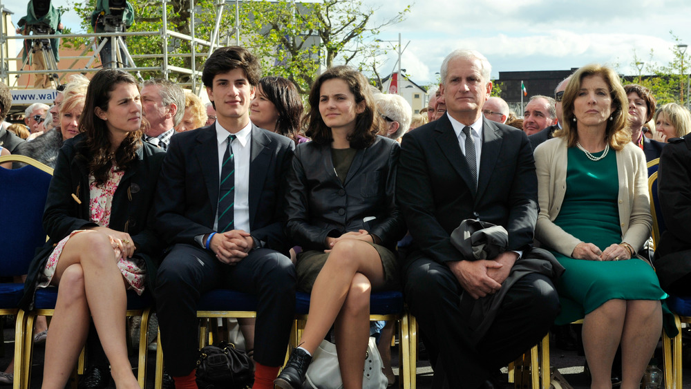 Jack Schlossberg and members of the Kennedy Family sitting down