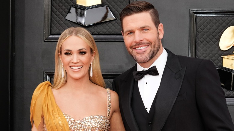 Carrie Underwood and Mike Fisher attend the 64th Annual Grammy Awards in Las Vegas, NV (2022)