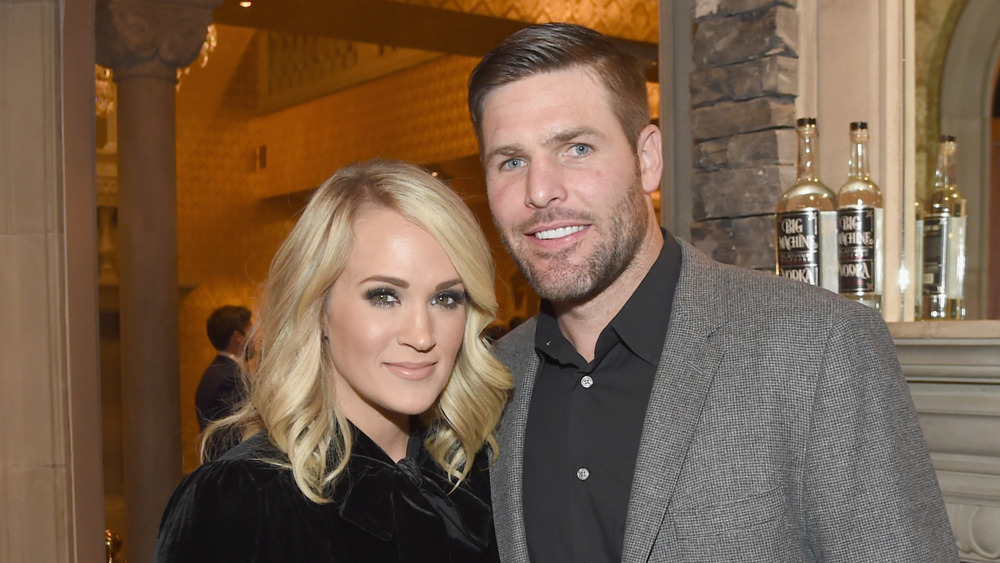 Carrie Underwood and Mike Fisher smiling