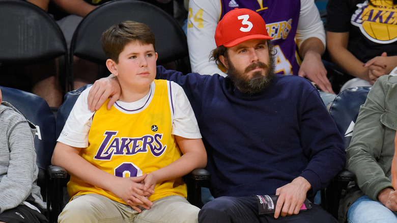 Casey Affleck with arm around son Indiana