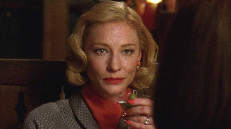 Cate Blanchett as Carol holding martini