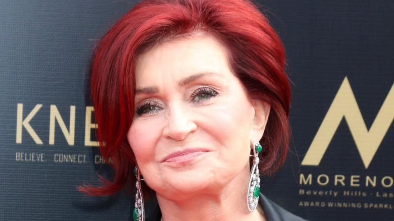 Sharon Osbourne smirking