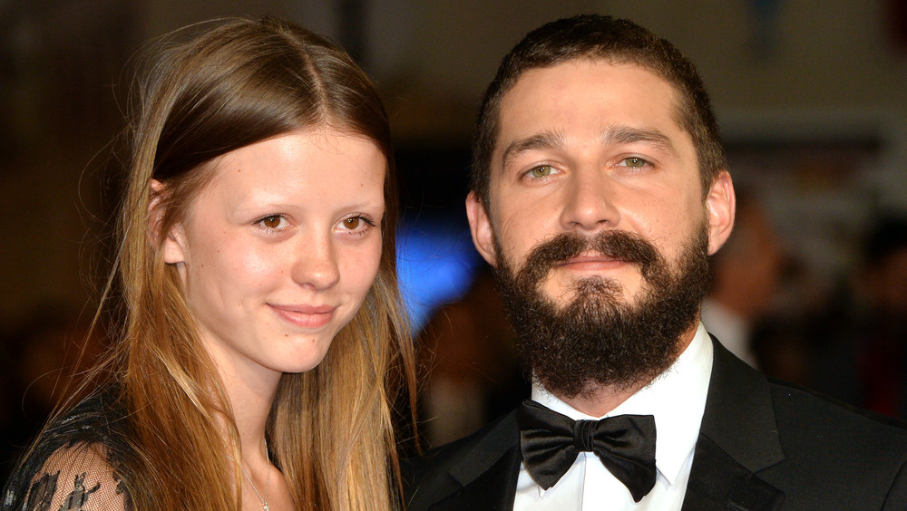 Shia LaBeouf and Mia Goth smiling 