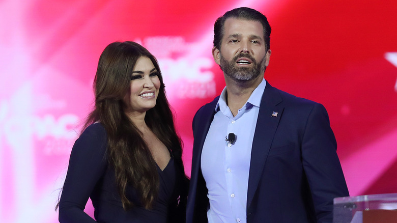 Kimberly Guilfoyle and Donald Trump Jr. stand onstage during the Conservative Political Action Conference