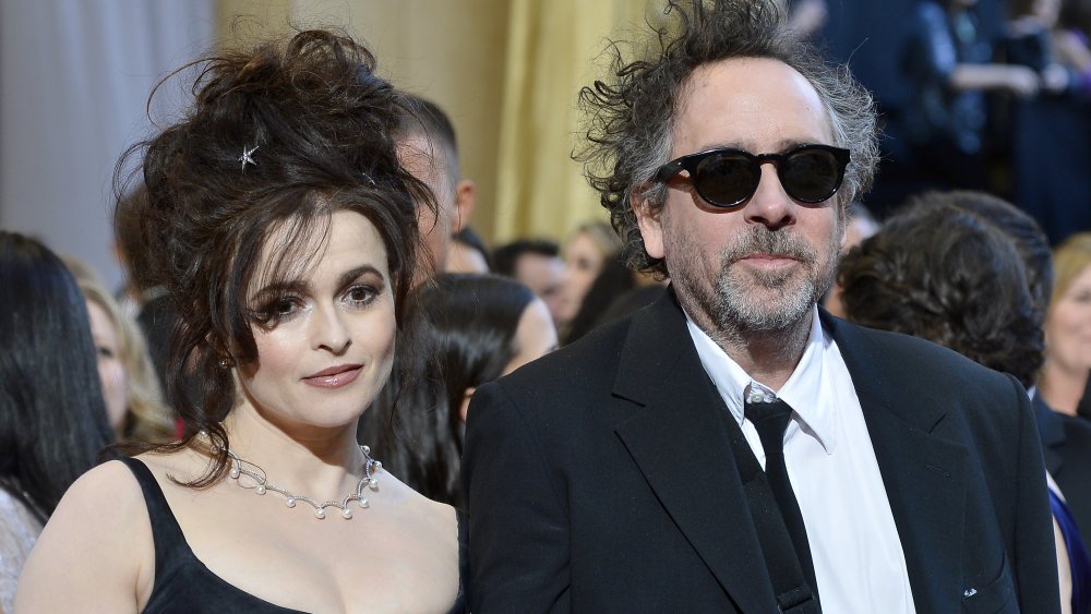 Helena Bonham Carter & Tim Burton at an event, both in black