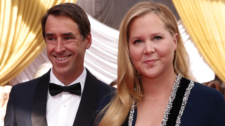 Amy Schumer and Chris Fischer smiling