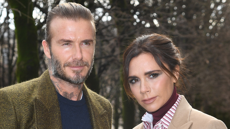 David Beckham and Victoria Beckham posing