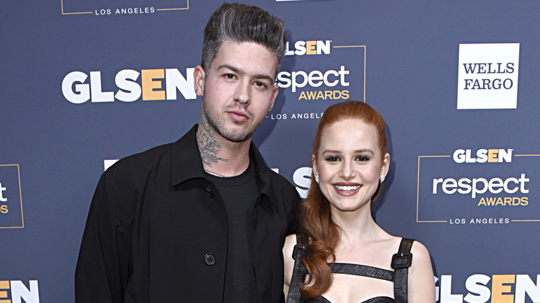 Madelaine Petsch with Travis Mills posing